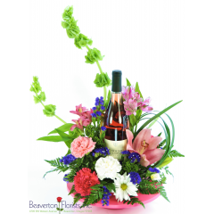 Beaverton Florists Beaverton - Anyone will have a rosy disposition after receiving this sweet design! Crisp and refreshing, the Cooper Mountain Rosé is the perfect choice for our summer days. Surrounded by pink, purple and white flowers and nestled in a pink tray.

Cooper Mountain Vineyards is located on the western slopes of Cooper Mountain in Beaverton, Oregon. Started in 1978, the certified organic wine maker produces Pinot Noir, Pinot Gris, Chardonnay, and many other varieties.

LOCAL ONLY