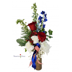 Beaverton Florists Beaverton - This beautiful collection of reds, whites and blues are made  in plastic cemetery vase with pick to stick in ground   ** Local delivery only**