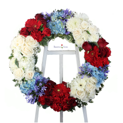 Beaverton Florists Beaverton - Red, white and blue 12" wreath.
Flowers may vary keeping always the color scheme. 